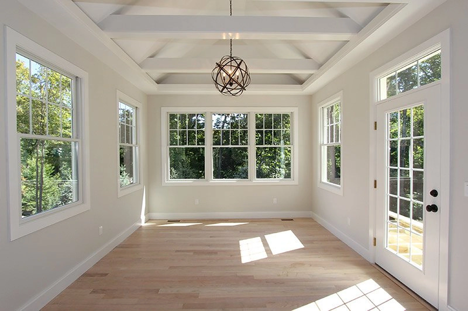 Craftsman sunroom with a coffered ceiling and windows on three sides