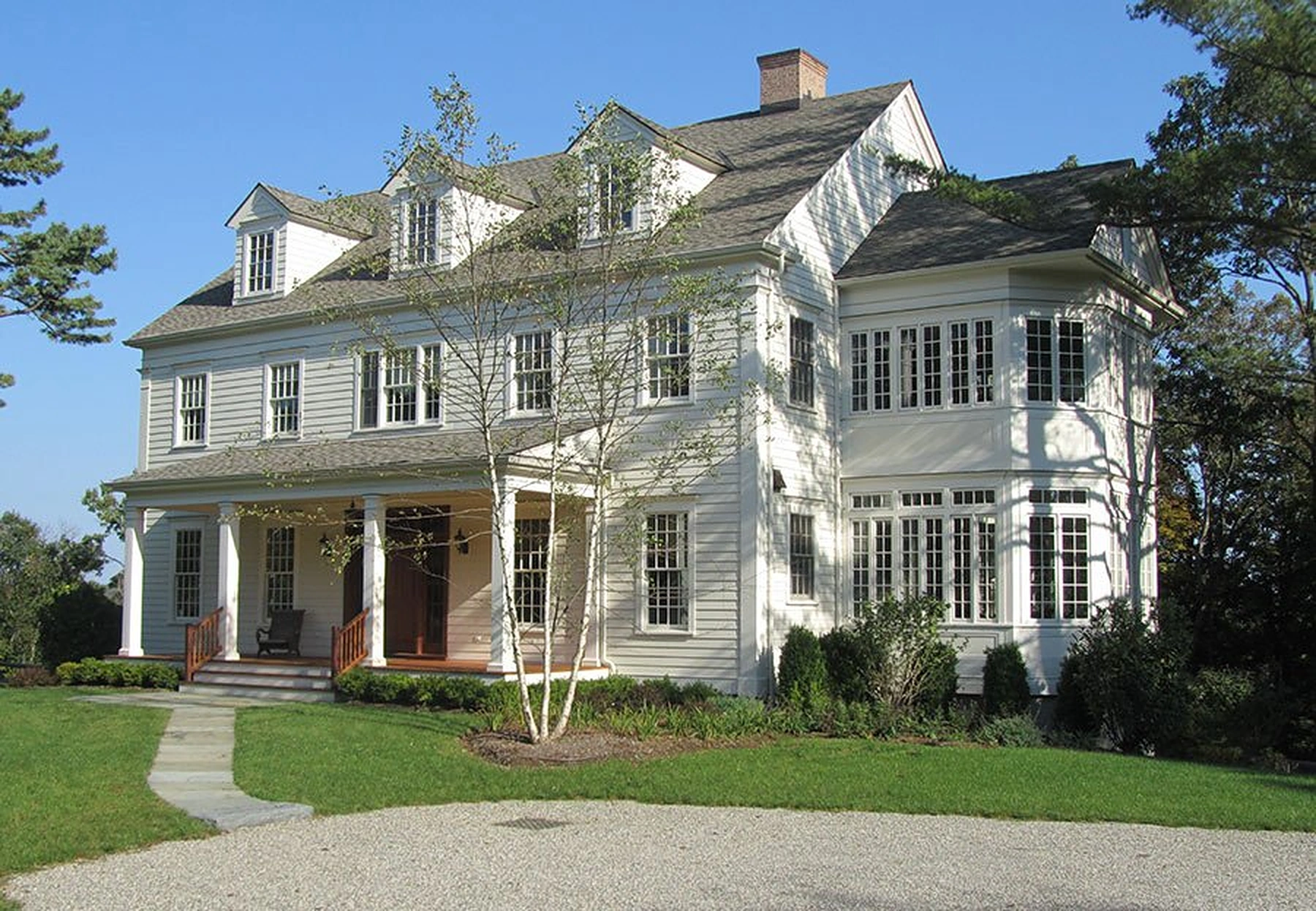 Salem Road home with a covered porch and two sunrooms